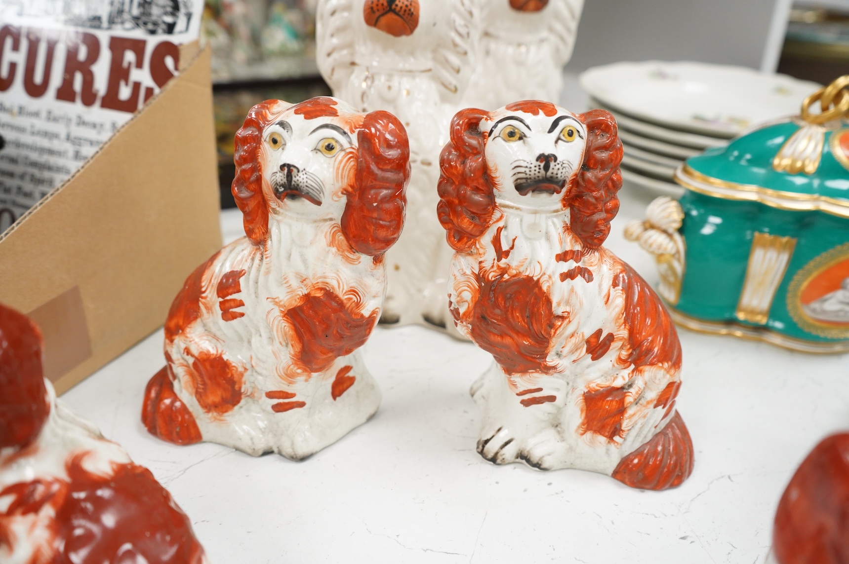Nine different sized 19th century Staffordshire chimney dogs, tallest 23cm